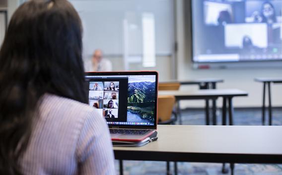 Person on her laptop during an online Zoom meeting.